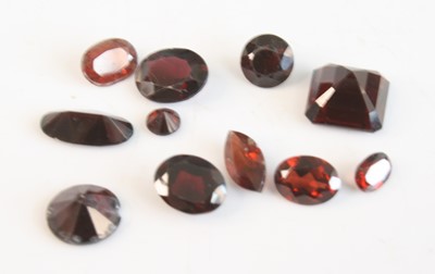 Lot 2528 - A collection of loose vari-cut garnets, the...