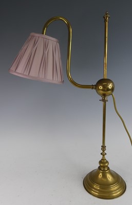 Lot 1222 - A lacquered brass tubular desk lamp, having...