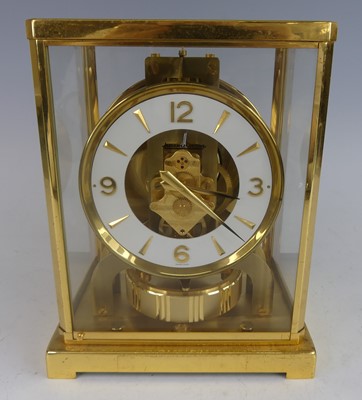 Lot 1235 - Jaeger Le Coultre - a gilt brass cased and...