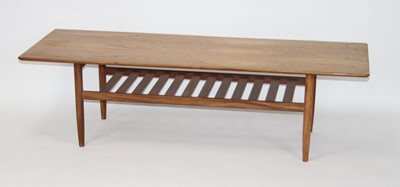 Lot 1359 - A 1960s G-plan teak long coffee table, the top...