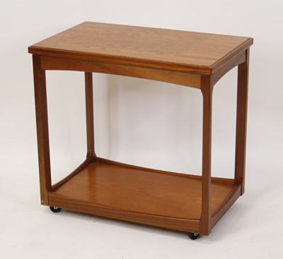 Lot 1421 - A 1970s teak two-tier fold-over tea trolley,...