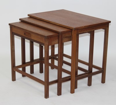 Lot 1380 - A 1960s teak nest of three occasional tables,...