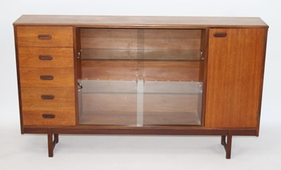 Lot 1424 - A 1970s Turnidge teak side cabinet, having...