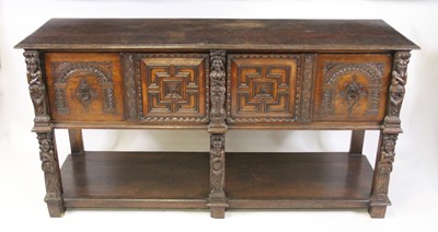 Lot 2547 - A carved and moulded oak sideboard in the...