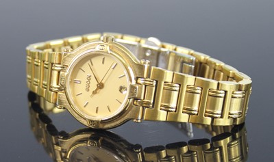Lot 2313 - A lady's Gucci gold plated quartz wristwatch,...