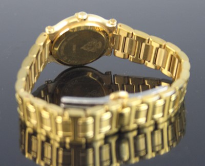 Lot 2313 - A lady's Gucci gold plated quartz wristwatch,...