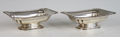 Lot 2178 - A pair of silver pedestal butter dishes, each...