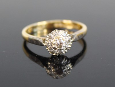 Lot 322 - An 18ct gold and platinum diamond circular...