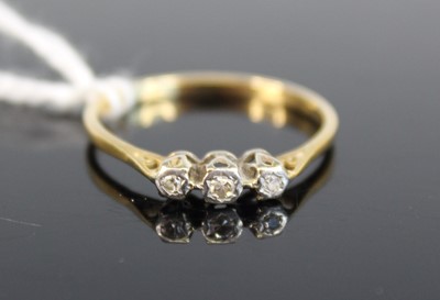 Lot 323 - A yellow and white metal diamond three stone...