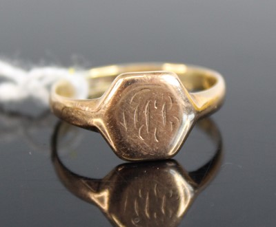 Lot 327 - A yellow metal hexagonal signet ring, with...