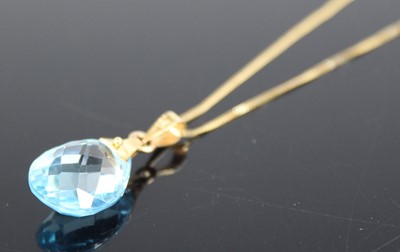 Lot 329 - A 9ct yellow gold blue topaz pendant,...