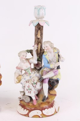 Lot 63 - A pair of German porcelain figural table...