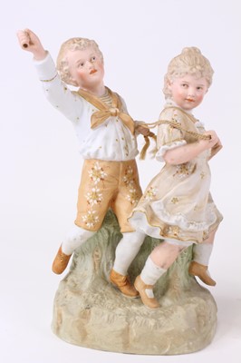Lot 63 - A pair of German porcelain figural table...