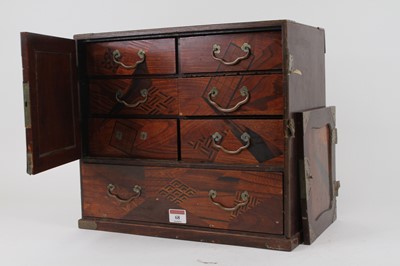 Lot 68 - A Japanese inlaid table cabinet, the cupboard...