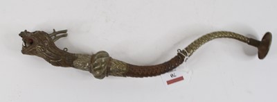Lot 70 - A Tibetan brass dragon horn, 38cm