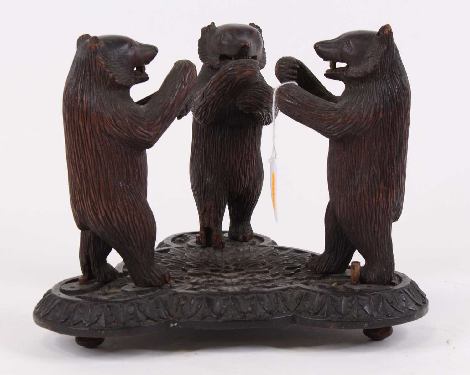 Lot 27 - An early 20th century Black Forest carved wood...
