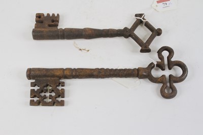 Lot 79 - Two large cast iron keys, the largest length 28cm