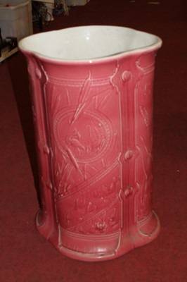 Lot 111 - A Victorian pink glazed pottery stickstand,...