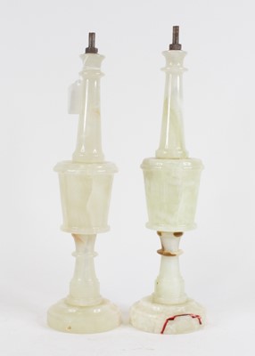 Lot 120 - A pair of polished onyx table lamps (lacking...