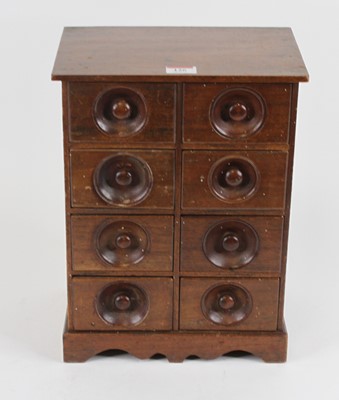 Lot 126 - A walnut table-top chest, containing an...