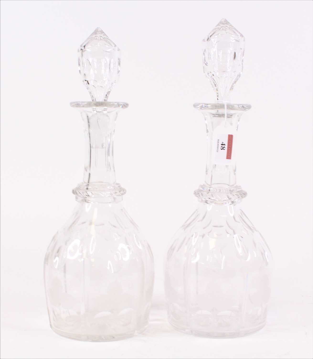 Lot 24 - A pair of cut glass decanters, each of mallet...