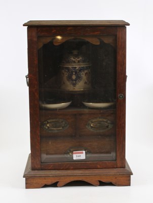Lot 160 - An early 20th century oak smoker's cabinet,...
