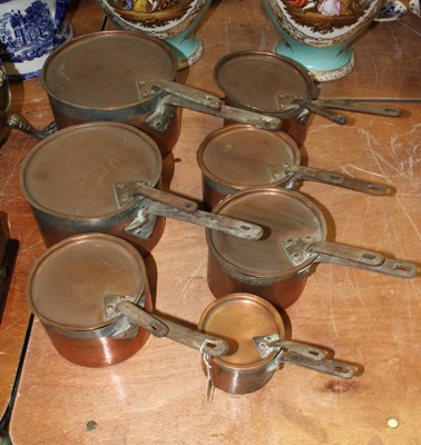 Lot 154 - A set of seven Victorian copper pans, the...