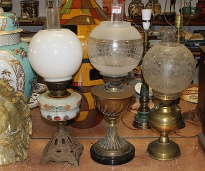Lot 158 - A collection of three Victorian oil lamps, the...