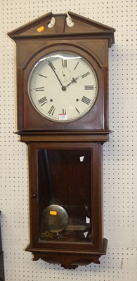 Lot 1120 - An early 20th century walnut droptrunk wall...