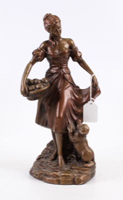 Lot 183 - A bronzed figure of a lady holding a basket of...