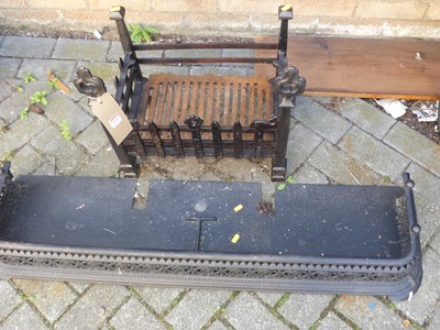 Lot 1129 - A cast iron black painted fire basket,...