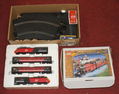 Lot 204 - A collection of toys to inlcude slot car...