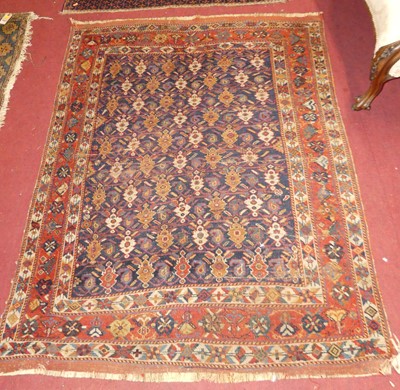 Lot 1144 - A Turkish woollen blue ground rug, the...