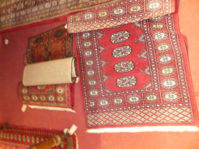 Lot 1149 - Three small Persian woollen red ground Bokhara...