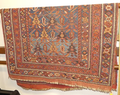 Lot 1156 - A Persian red and blue ground Tabriz rug, with...