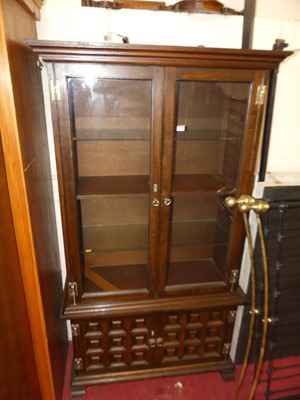 Lot 1168 - A contemporary Spanish elm display cabinet,...