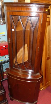 Lot 1176 - A reproduction mahogany freestanding corner...