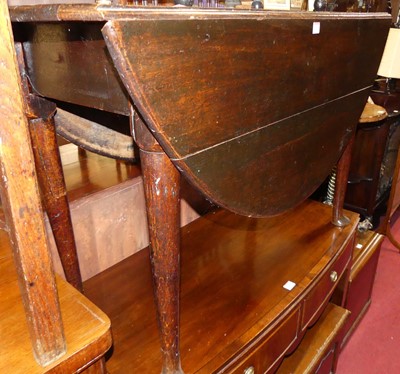 Lot 1201 - An early 19th century provincial oak dropleaf...