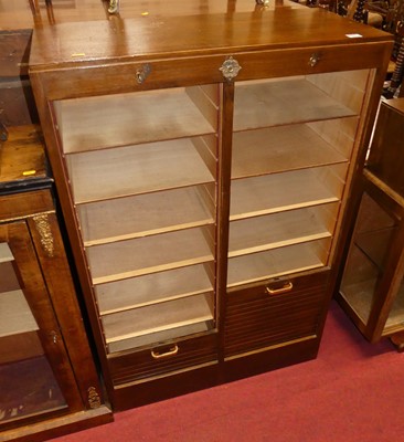 Lot 1224 - A 1930s oak twin tambour fronted office filing...