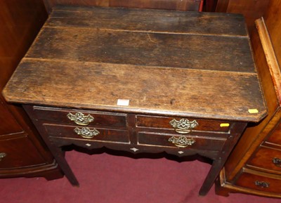 Lot 1252 - An 18th century provincial plank top oak four...