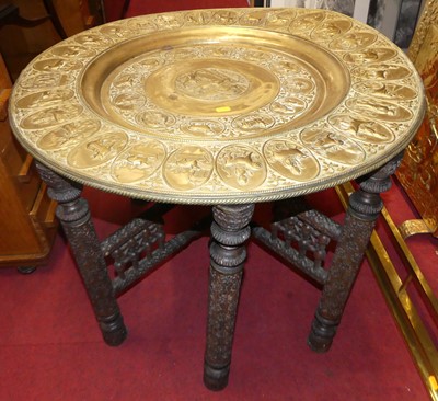 Lot 1064 - A Benares brass topped occasional table, on...