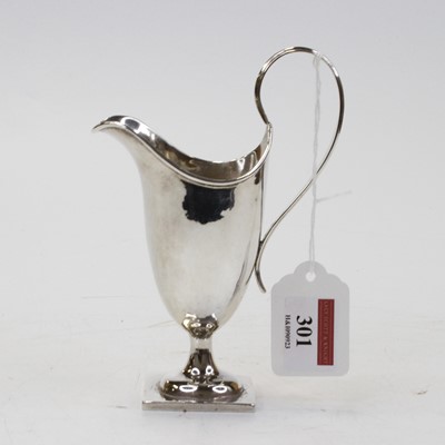 Lot 301 - An Edwardian silver helmet shaped cream jug, 2....