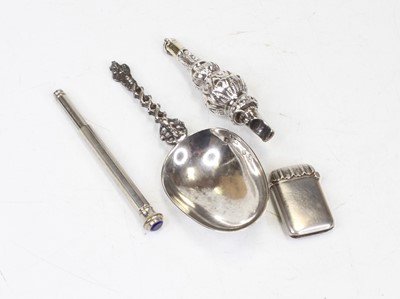 Lot 411 - A white metal baby's rattle (lacking teethers),...