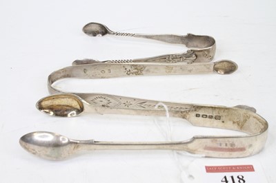 Lot 418 - A pair of George II silver sugar tongs, having...