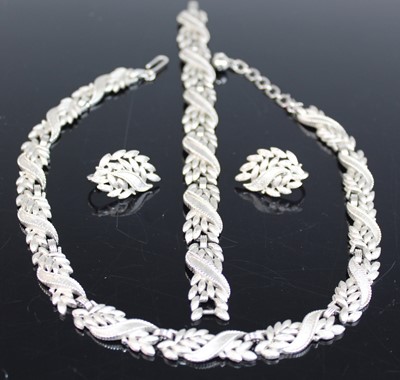 Lot 366 - A Trifari white metal suite of jewellery,...