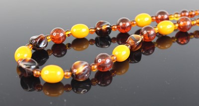 Lot 368 - A faux amber beaded necklace; together with a...