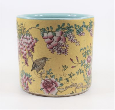 Lot 254 - A Chinese porcelain brush pot, enamel...