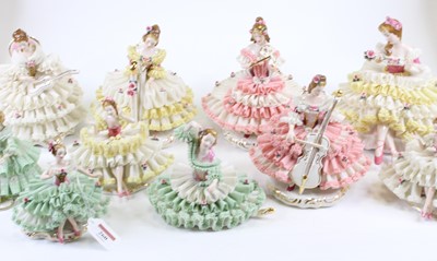 Lot 260 - A collection of ten Dresden porcelain figures...