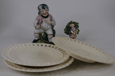 Lot 224 - A 19th century porcelain bocage figure, having...