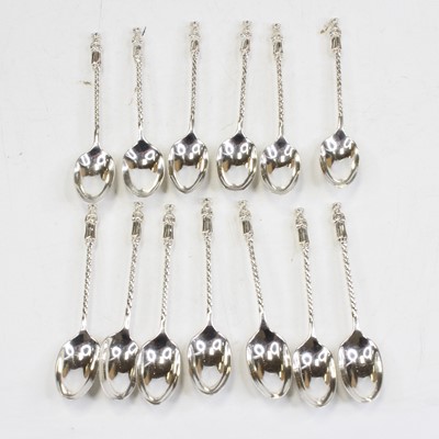 Lot 464 - A set of thirteen early 20th century silver...